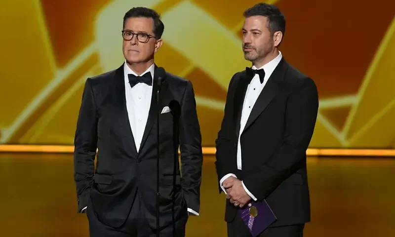 LOS ANGELES, CALIFORNIA - SEPTEMBER 22: (L-R) Stephen Colbert and Jimmy Kimmel speak onstage during the 71st Emmy Awards at Microsoft Theater on September 22, 2019 in Los Angeles, California. (Photo by Kevin Winter/Getty Images)