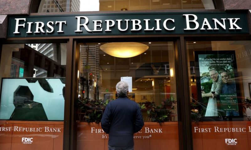 SAN FRANCISCO, CALIFORNIA - MAY 01: A passerby stops to read a posted announcement from the FDIC about the seizure of First Republic Bank and sale to JPMorgan Chase on May 01, 2023 in San Francisco, California. Federal Regulators seized troubled lender First Republic Bank on Monday and sold all of its deposits and most of its assets to JPMorgan Chase. First Republic becomes the second largest bank in U.S. history to fail since Washington Mutual failed in 2008. (Photo by Justin Sullivan/Getty Images)