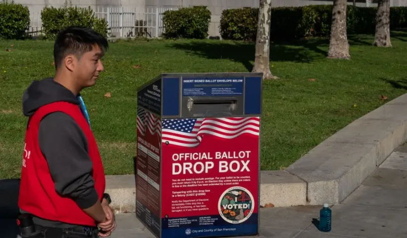 Poll workers stand by an official ballot drop box on the final day of early voting ahead of Election Day at City Hall on November 4, 2024 in San Francisco, California. Millions of Americans will cast their ballots tomorrow in the presidential race between Republican nominee former President Donald Trump and Democratic nominee Vice President Kamala Harris, as well as multiple state elections that will determine the balance of power in Congress. (Photo by Loren Elliott/Getty Images)