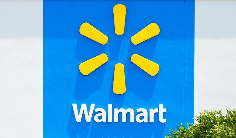 AUSTIN, TEXAS - MAY 15: In an aerial view, the logo of a Walmart Supercenter is seen on May 15, 2025 in Austin, Texas. Walmart surpassed first-quarter earnings estimate, while falling short of quarterly sales. Chief Financial Officer John David Rainey has said that consumers could begin to see price hikes as early as later this month due to the various newly enacted Trump administration tariffs. (Photo by Brandon Bell/Getty Images)