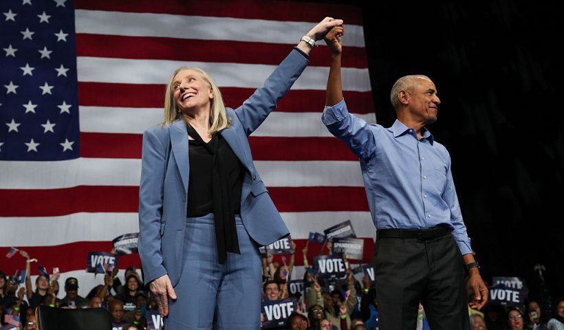 NORFOLK, VIRGINIA - NOVEMBER 01: Former U.S. President Barack Obama (R) and Virginia Democratic gubernatorial candidate, former Rep. Abigail Spanberger raise their arms together during a campaign rally in the Chartway Arena on November 01, 2025 in Norfolk, Virginia. Spanberger will face off against Republican candidate Winsome Earle-Sears in the Commonwealth of Virginia’s off-year election for governor and other statewide offices on November 4. (Photo by Win McNamee/Getty Images)