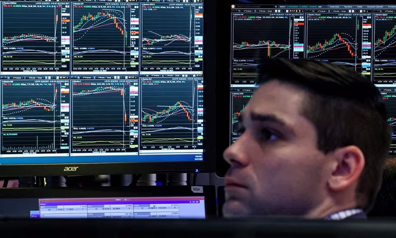 A trader works on the floor at the New York Stock Exchange (NYSE) in New York City, U.S., October 27, 2023. REUTERS/Brendan McDermid/File Photo