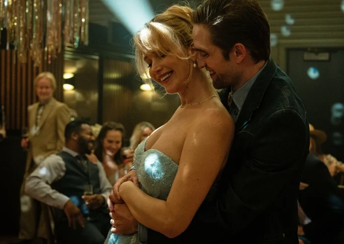This image released by Mubi shows Jennifer Lawrence, left, and Robert Pattinson in a scene from “Die My Love.” (Kimberly French/Mubi via AP)