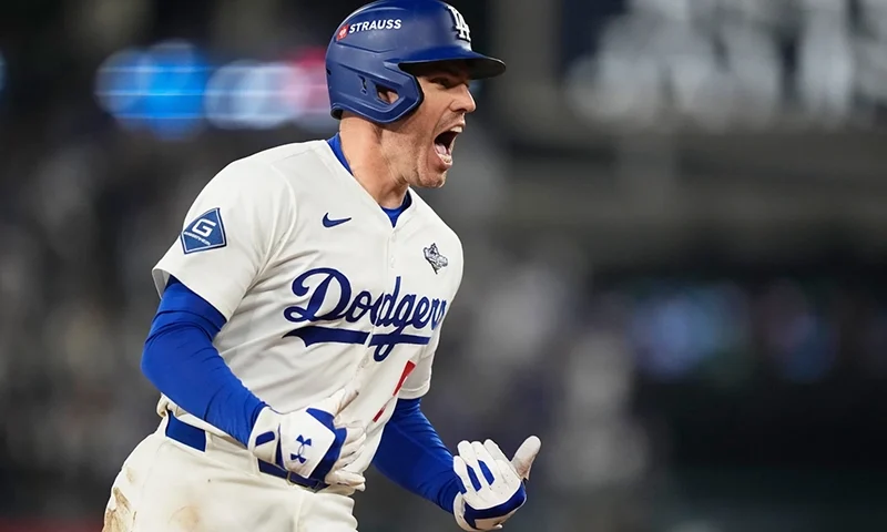 Los Angeles Dodgers’ Freddie Freeman celebrates his walk off home run against the Toronto Blue Jays during the 18th inning in Game 3 of baseball’s World Series, Monday, Oct. 27, 2025, in Los Angeles.(AP Photo/Brynn Anderson)
