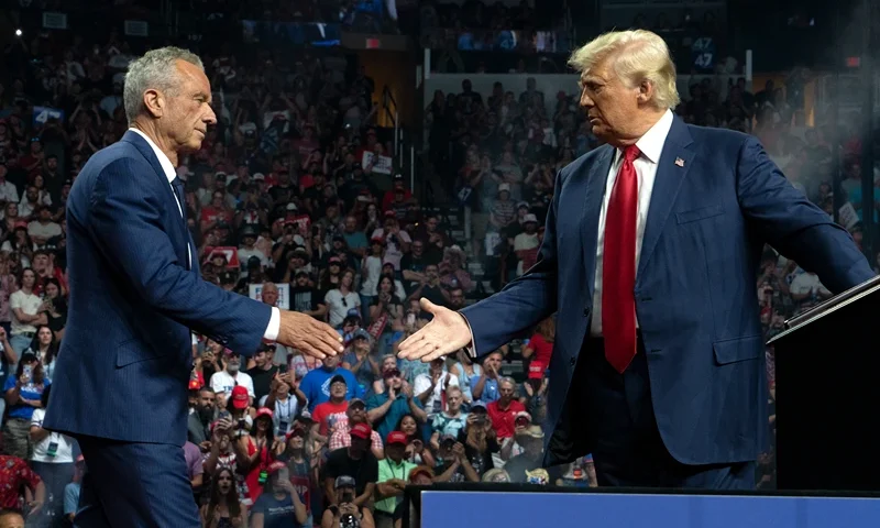 GLENDALE, ARIZONA - AUGUST 23: Former Republican presidential candidate Robert F. Kennedy Jr. and Republican presidential nominee, former U.S. President Donald Trump shake hands during a campaign rally at Desert Diamond Arena on August 23, 2024 in Glendale, Arizona. Kennedy announced today that he was suspending his presidential campaign and supporting former President Trump. (Photo by Rebecca Noble/Getty Images)