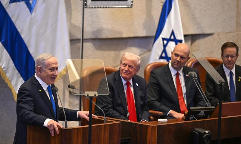 JERUSALEM - OCTOBER 13: (L-R) Prime Minister of Israel Benjamin Netanyahu speaks next to US President Donald Trump, Knesset Speaker Amir Ohana and Israel's President Isaac Herzog at the Knesset, Israel's parliament, on October 13, 2025 in Jerusalem. President Trump is visiting the country hours after Hamas released the remaining Israeli hostages captured on Oct. 7, 2023, part of a US-brokered ceasefire deal to end the war in Gaza. (Photo by Kenny Holston - Pool/Getty Images)