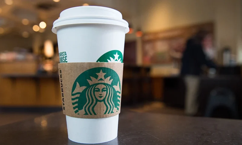 A Starbucks coffee cup is seen inside a Starbucks Coffee shop in Washington, DC, April 17, 2018, following the company's announcement that they will close more than 8,000 US stores on May 29 to conduct "racial-bias education" following the arrest of two black men in one of its cafes. (Photo by SAUL LOEB / AFP) (Photo by SAUL LOEB/AFP via Getty Images)