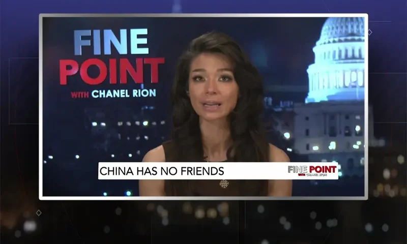 Video still of the host of Fine Point at the desk of their talk show on One America News Network.