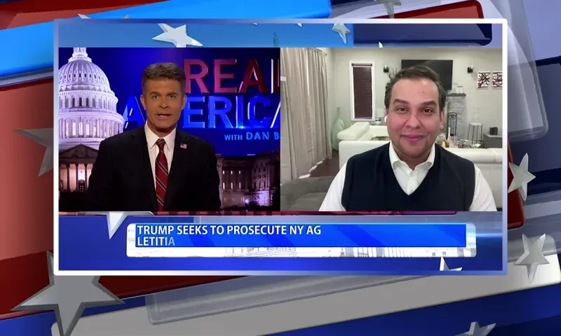 Video still from Real America on One America News Network showing a split screen of the host on the left side, and on the right side is the guest, George Santos.